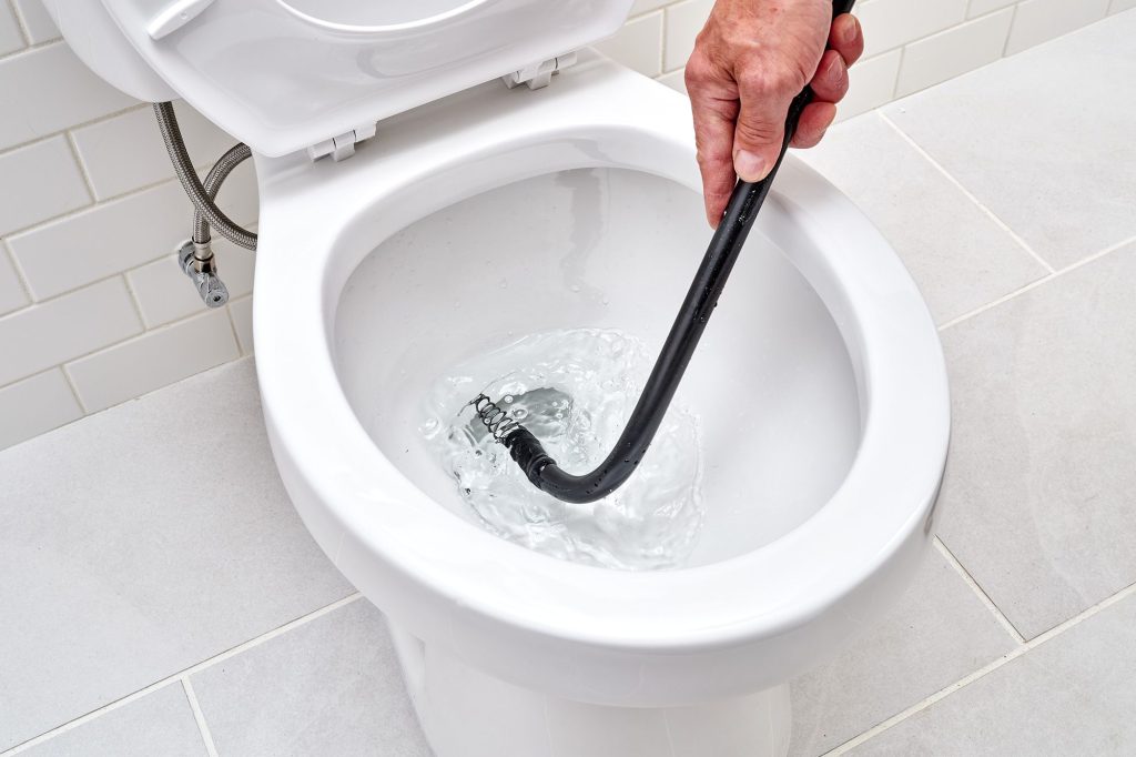 How Does A Plumber Fix A Clogged Toilet
