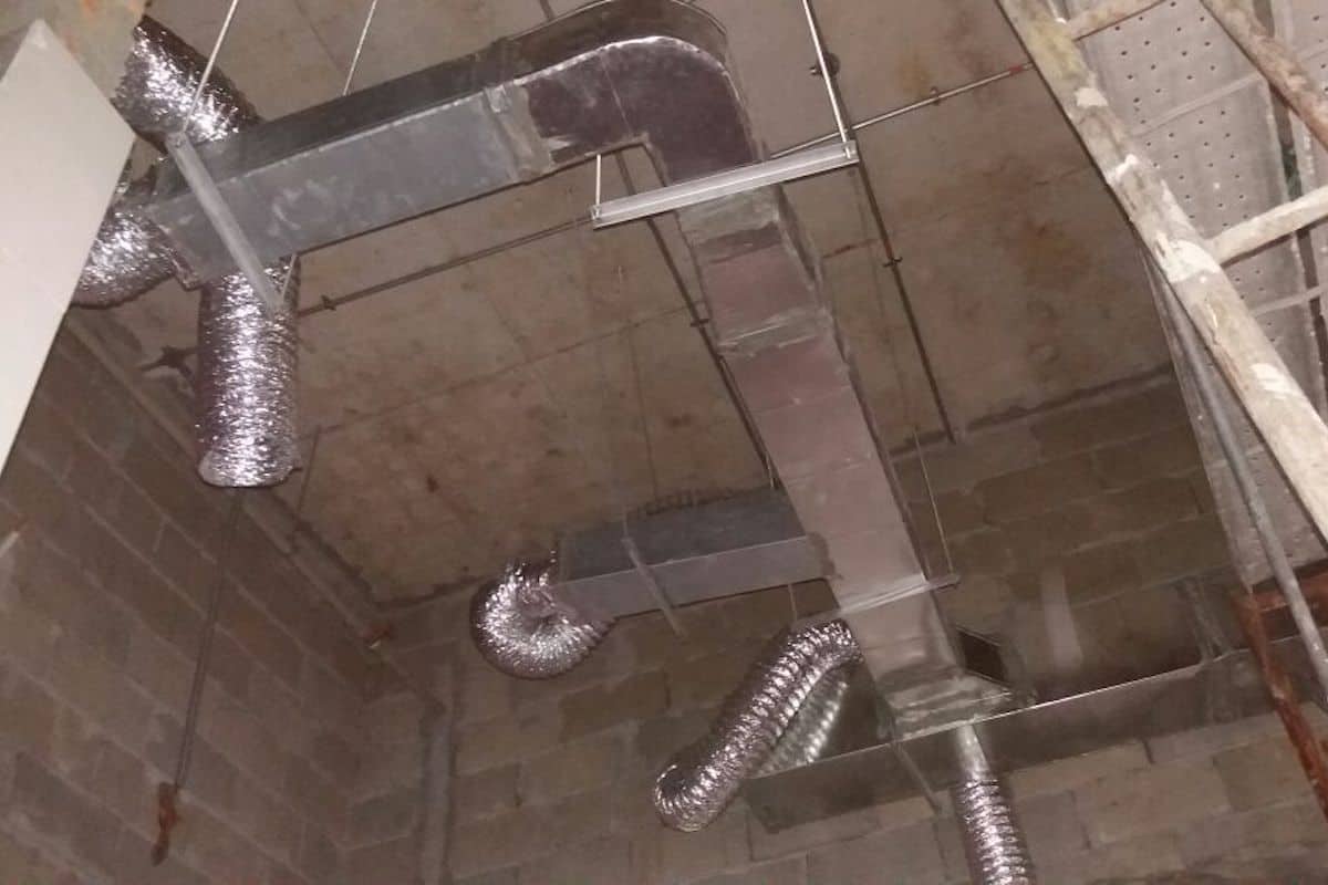 Can Plumbing and Exhaust Ducts Share the Same Shaft?