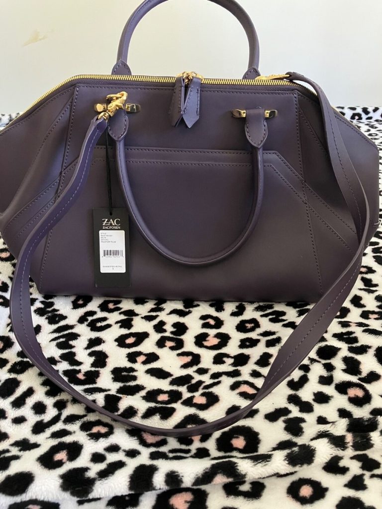 Delta Flight 2018 For Plumb Colored Leather Handbag For Sale