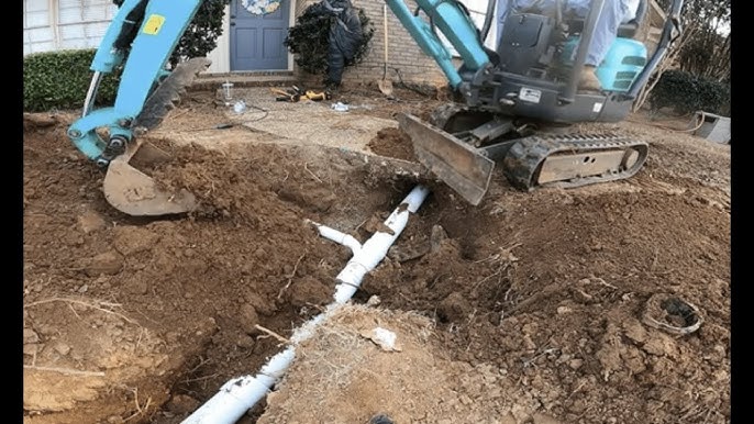 Digging A Hole On A Backhoe Looking For Plumbing Problems