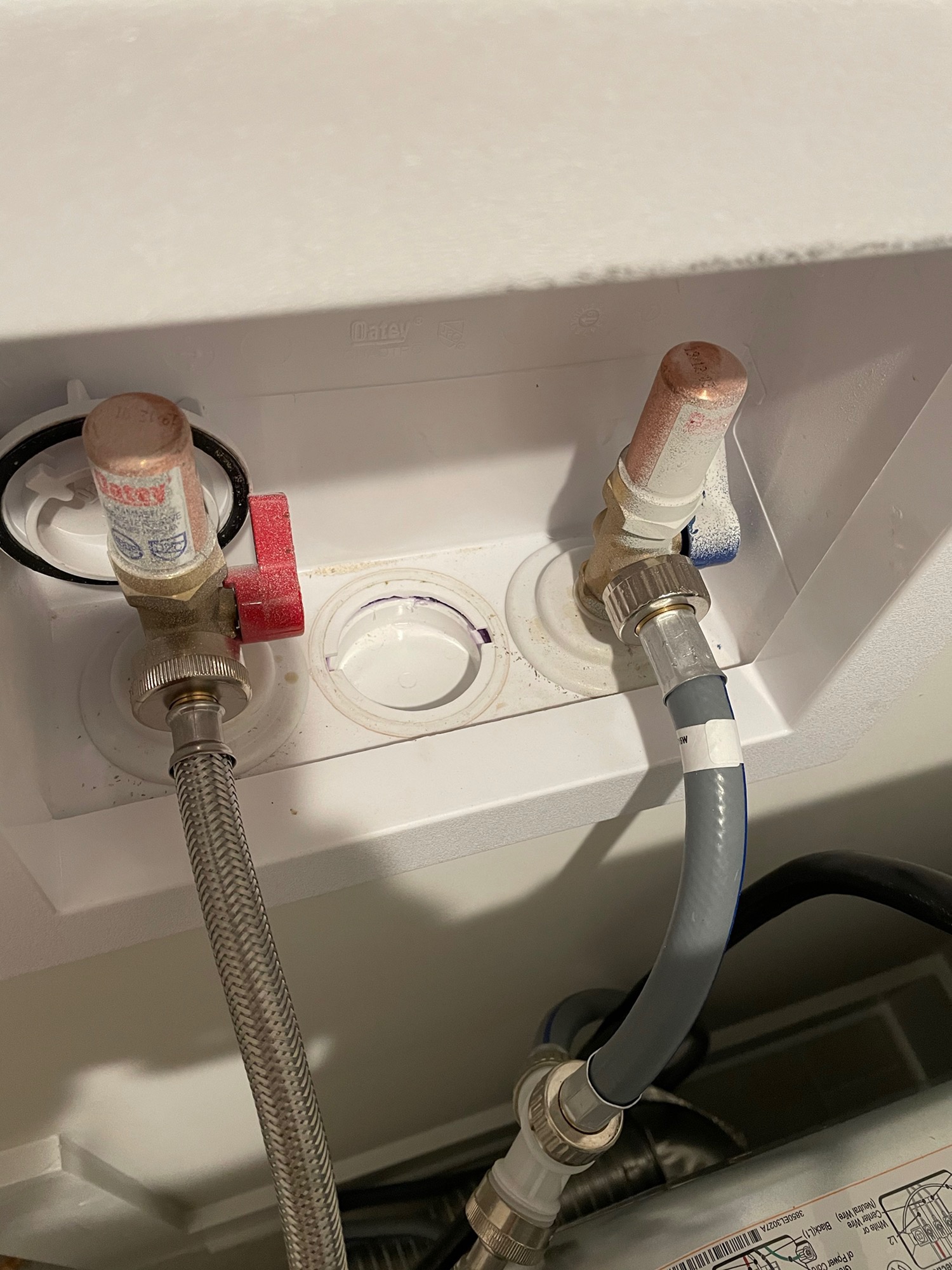 How Do I Loosen a Stuck Washer Plumbing Cap Fitting?