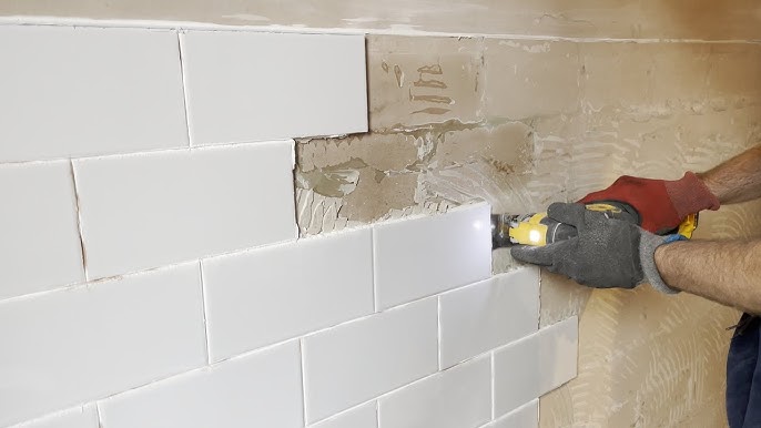 How to Remove One Large Wall Tile for Plumbing Repair
