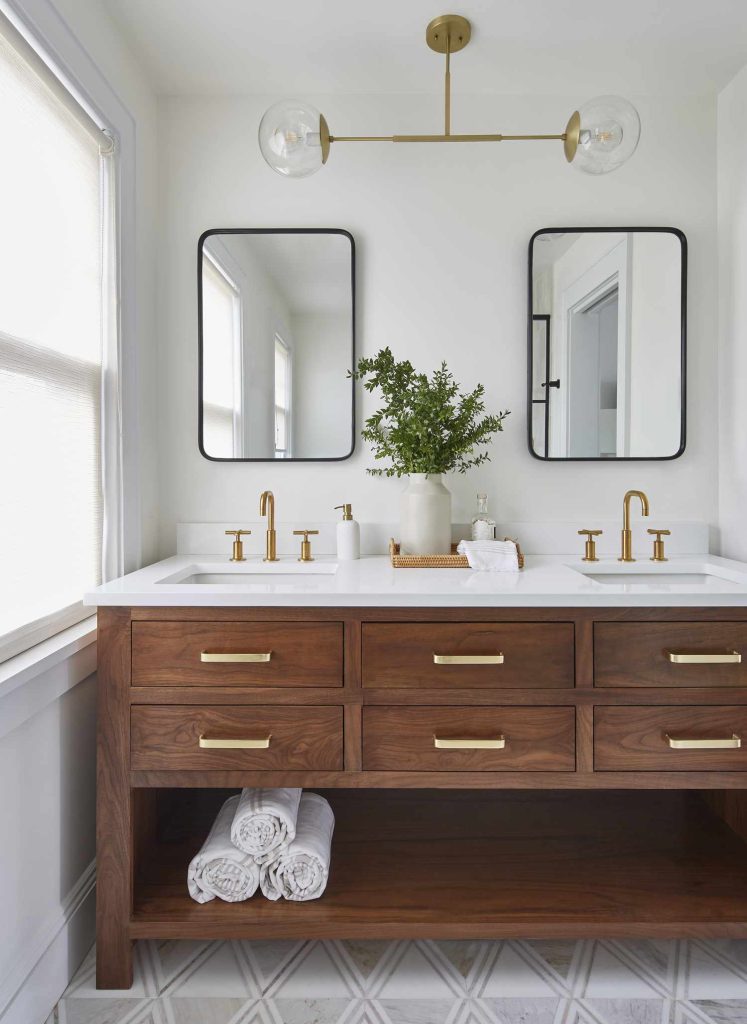 Mix Of Gold And Black Plumbing Fixtures In A Bathroom
