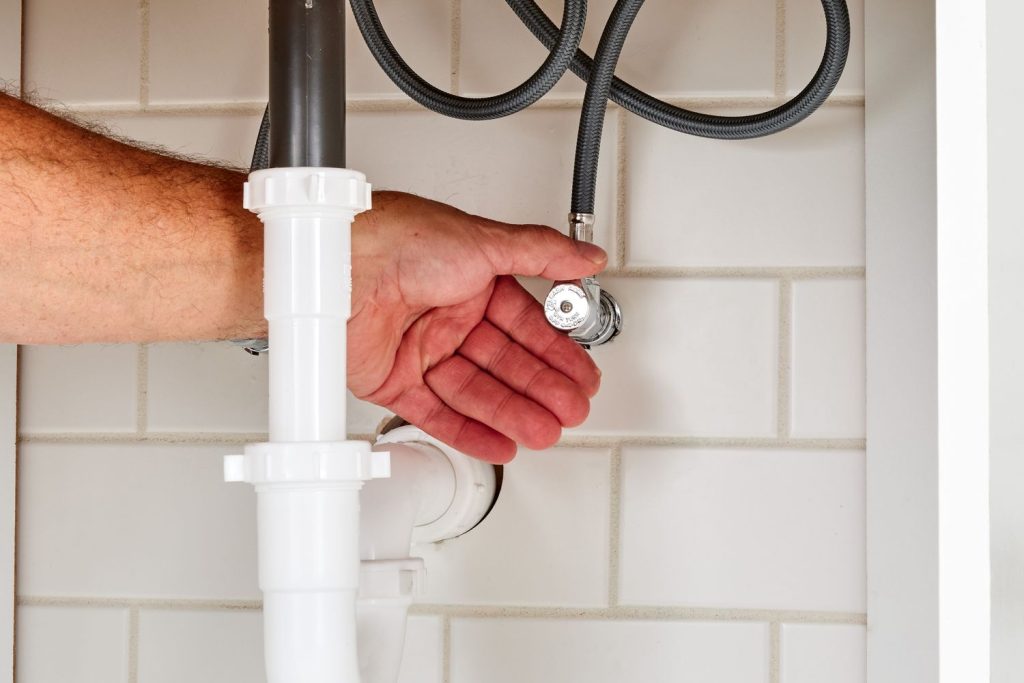 A Plumber Is Going To Fix The Leaky Faucet