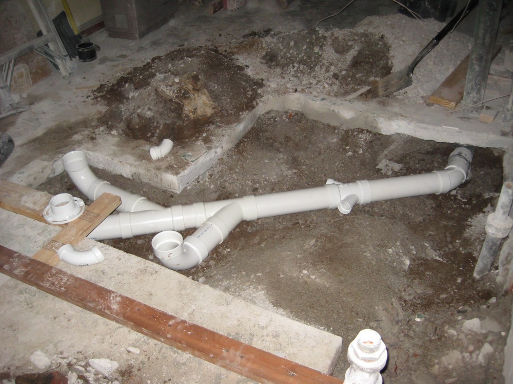 Moving Plumbing in Post-Tension Slabs: The Risks & Rules