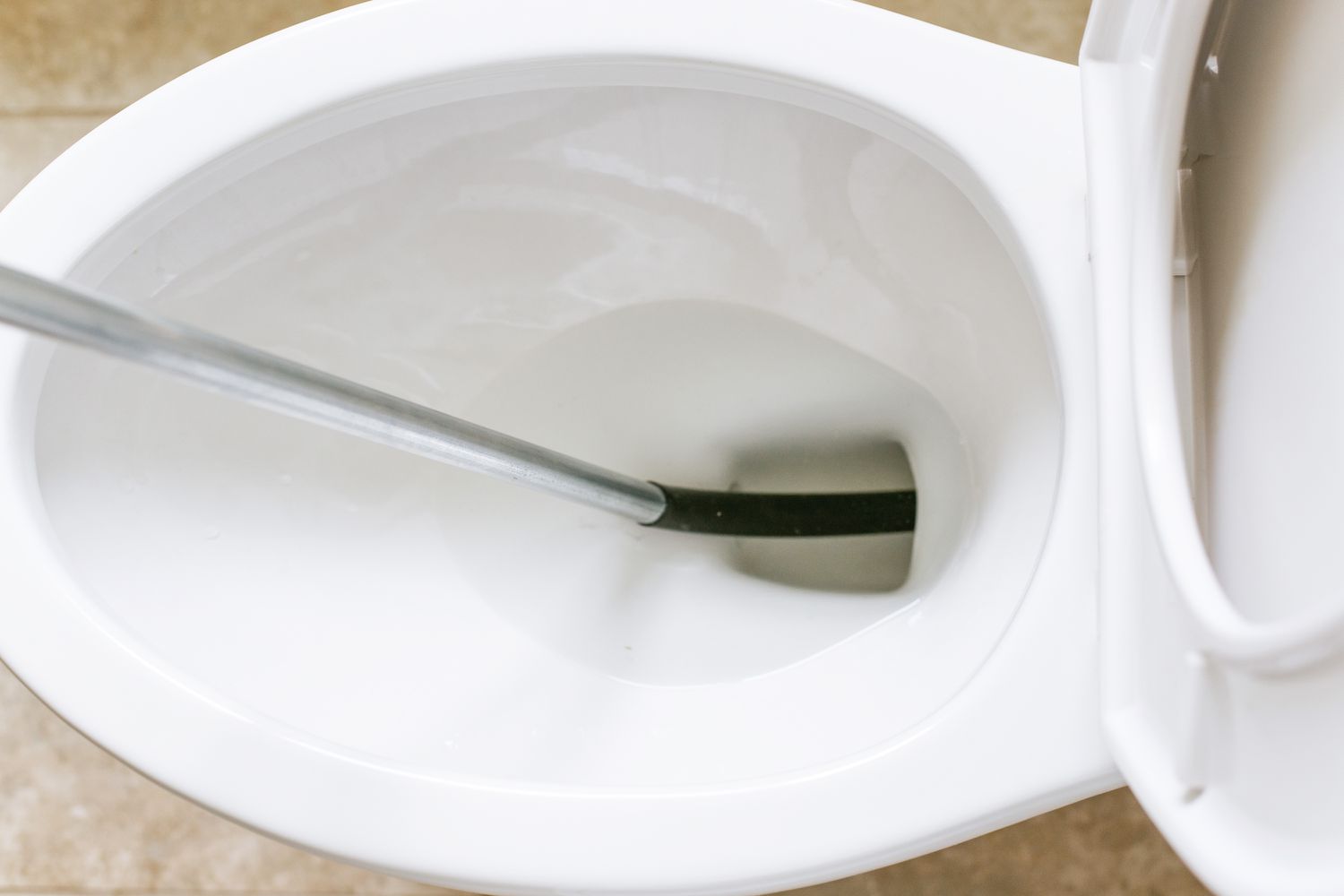 Do You Need a Plumber to Auger a Toilet?