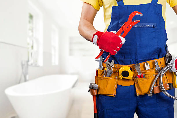 Man In Suit Wearing Construction Tools Working On Plumbing