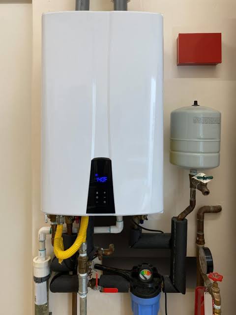 Plumber Installation Of Expansion Tank With Tankless Water Heater