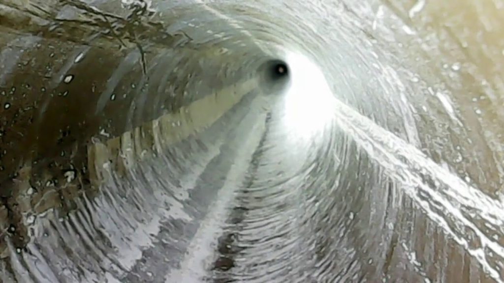 Plumbing Specialist Using Borescope To Look Inside Water Lines
