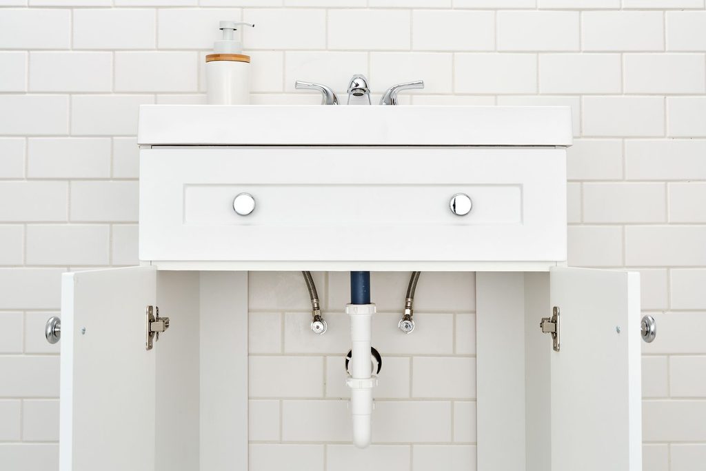 Bathroom Vanity Has Plumbing Through Back Of Cabinet